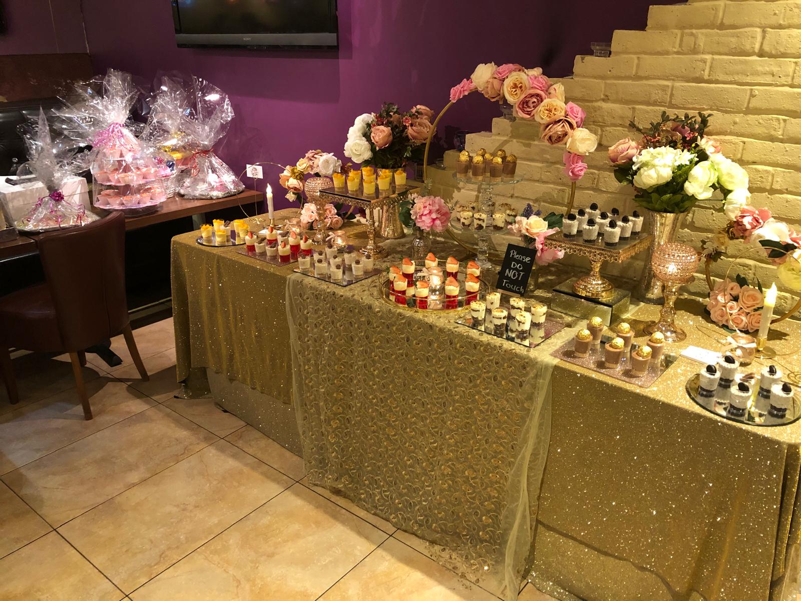 An event dessert table set up at Zaiqa London for a private celebration